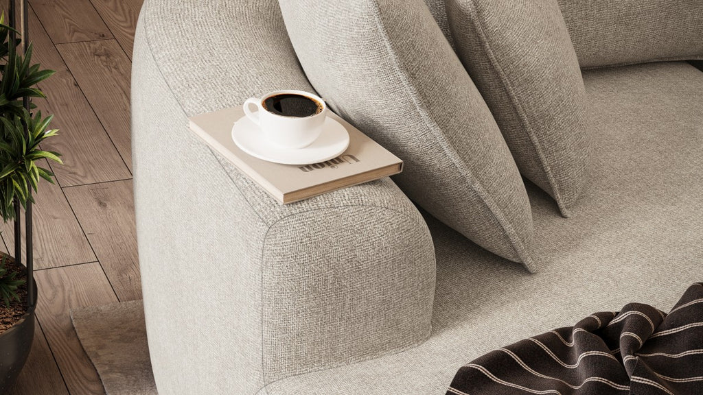Curved sectional sofa in a box in beige